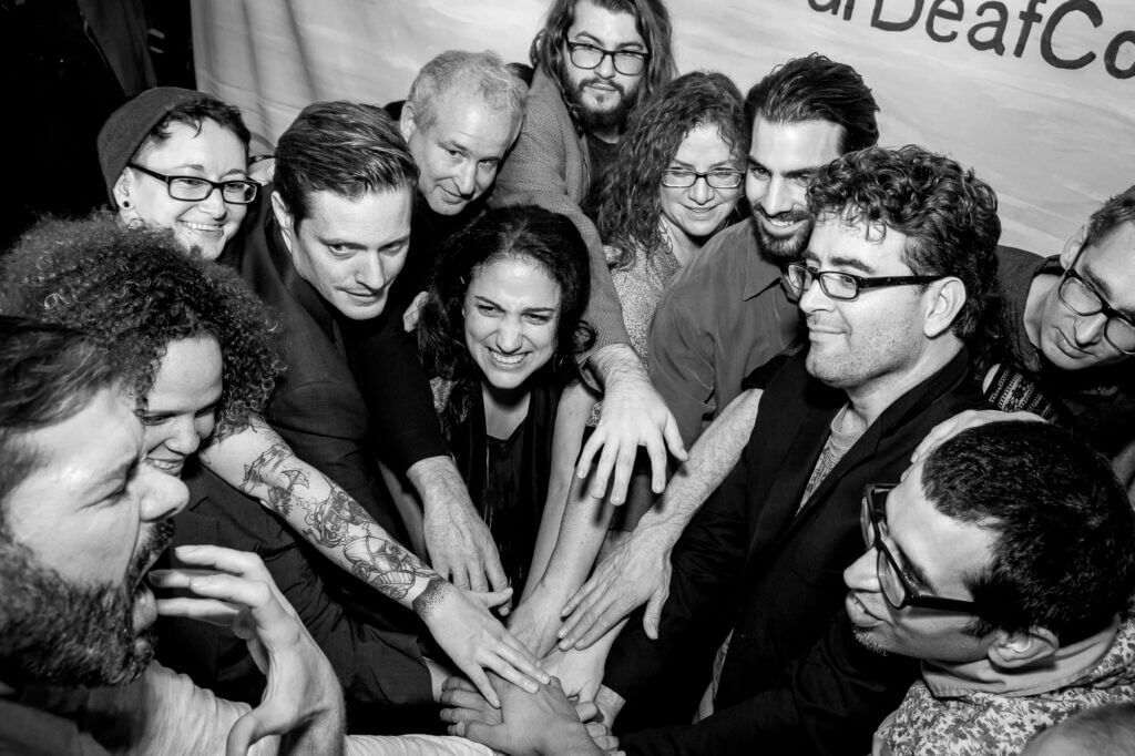 People huddling together for a cheer spirit