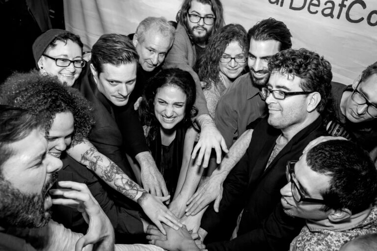 People huddling together for a cheer spirit